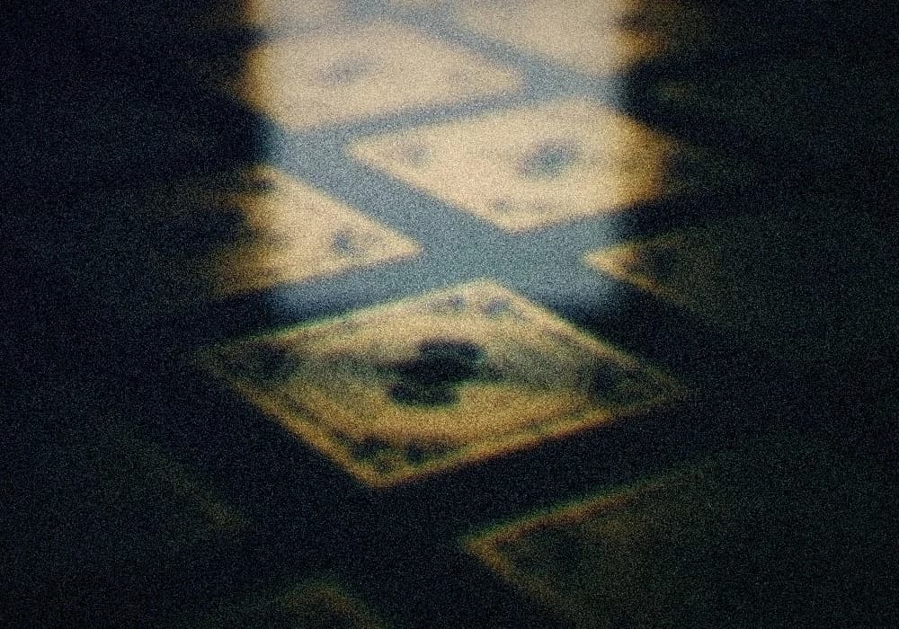 Macro close-up of a semiconductor wafer and chip array, gold circuitry catching light