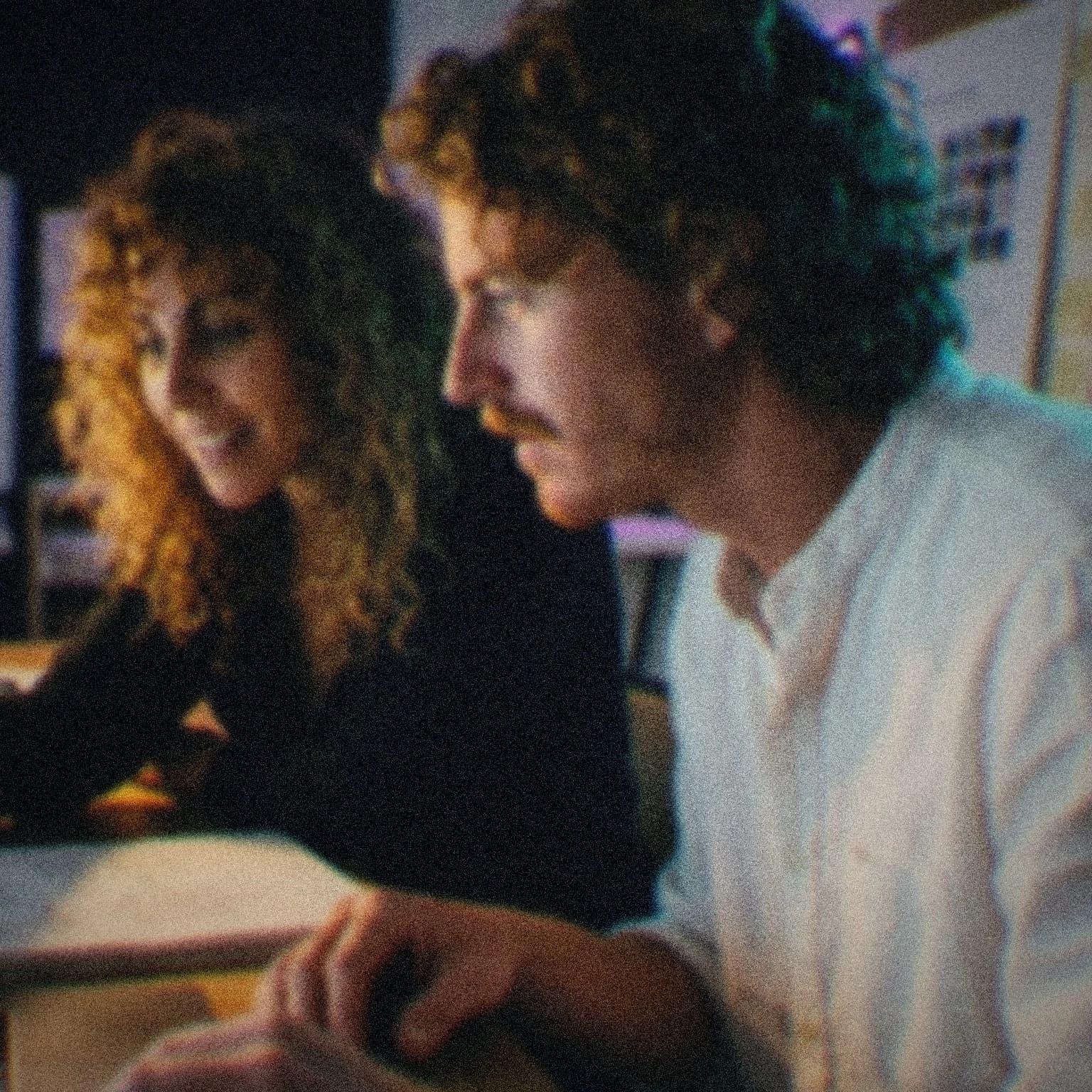 John Ellison and Fatma working through a build together at a workshop table