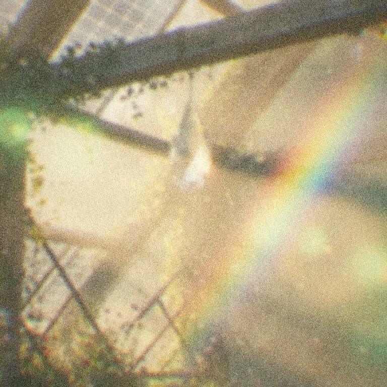 Structure seen through glass at noon, order bent into a brighter spectrum.