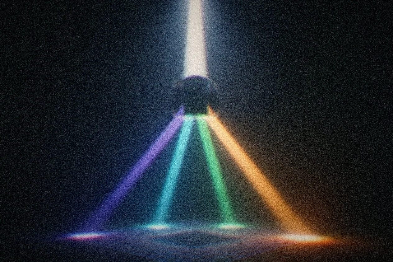 A beam of light entering a prism from above and refracting downward into four distinct colored beams, each radiating outward and down like four separate paths from one source.